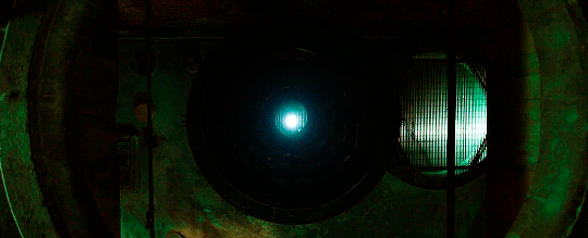 A spiral-shaped torture device spinning into view from the darkness